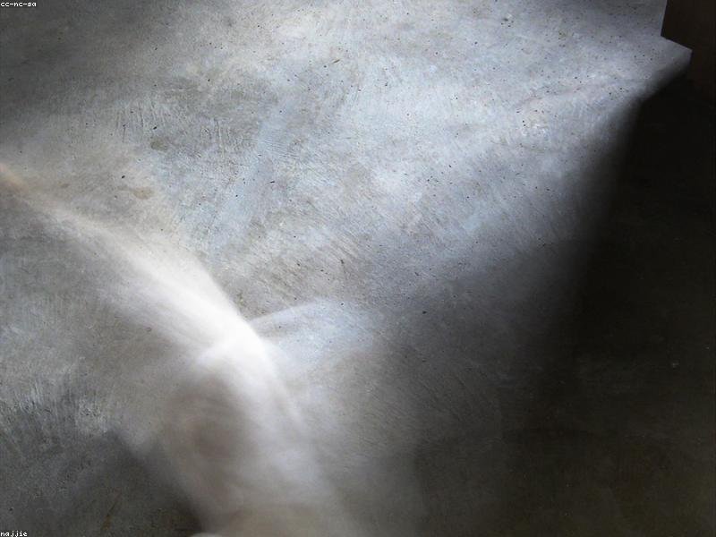 Smooth concrete floor detail showing the kind of finish used in bench footing work
